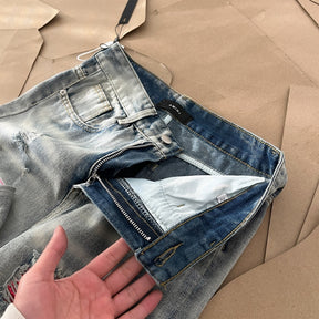 AMIRI Jeans Destroyed – Logo Rosa