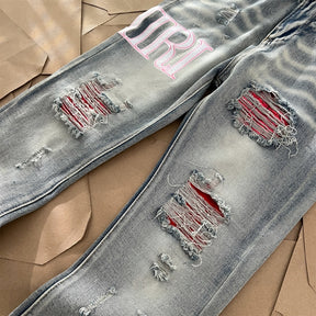 AMIRI Jeans Destroyed – Logo Rosa